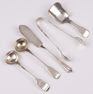 Two Georgian silver fiddle pattern mustard spoons, London 1805 and 1809, a Victorian silver fiddle pattern caddy spoon, London 1855, a silver butter knife Birmingham 1893 and  a pair of apostle sugar tongs London 1912, 79 grams 