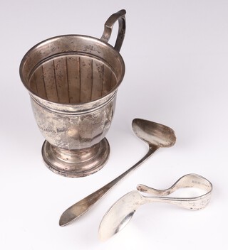 A silver christening tankard, monogrammed, Birmingham 1932, together with a child's spoon and pusher Birmingham 1930, by I S Greenberg, 113 grams 