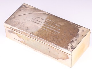 A rectangular silver cigarette box with hinged lid, Chester 1898 by George Nathan & Ridley Hayes, marks rubbed, the lid inscribed "Presented to Mrs Edith C Vere from The Mining and Metallurgy Club in recognition of your loyal and devoted service" 1919 to 1952 5cm h x 20cm w x 9cm d 