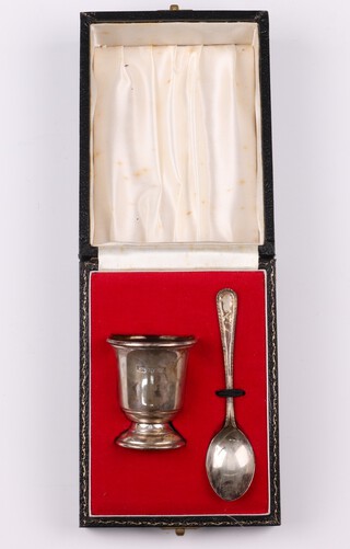 A silver egg cup and spoon Birmingham 1975 by A T Cannon Ltd., 35 grams, boxed 