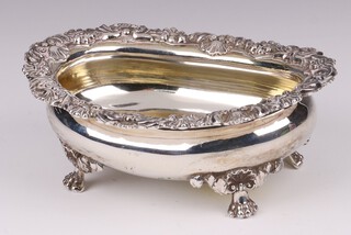 A William IV oval silver salt with cast rim, raised on hoof supports London 1824 by Benjamin Smith II, 161 grams 