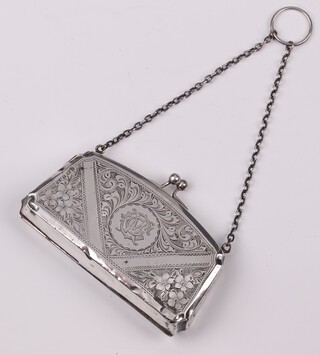 A engraved silver purse of shaped form, Birmingham 1919 by I M Hitchfield, 79 grams gross 
