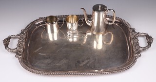 A heavy gauge silver plated twin handled tea tray with inscription "Presented to Miss Betty Strickland on the occasion of her marriage 20th June 1929 by the Cottages and Cricket Club of Boynton", a hotel ware coffee pot and sugar bowl, plated tankard and sugar tongs 