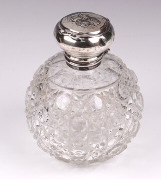 A cut glass globular shaped scent bottle with glass stopper, the silver hinged lid decorated Botticelli angels Birmingham 1904 10cm 