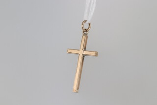 A 9ct gold cross pendant, 2.5cm, 1.2 grams