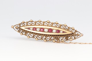 A Victorian 15ct gold marked 625 bar brooch set 5 rubies and 5 diamonds, with safety bar and chain, 5cm w, 6.1 grams gross