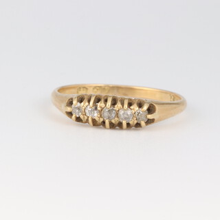 An 18ct gold ring set 5 diamonds, size O 1/2, 2.3 grams