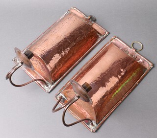 A pair of Arts and Crafts planished copper convex shaped girandoles 34cm h x 18cm w   