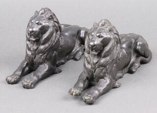 A pair of 19th Century cast spelter figures of reclining lions 13cm h x 24cm w 