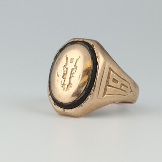 An American gold "college" ring marked 10K Jenkins Baltimore, the shoulders dated 1934, 6.8 grams gross 