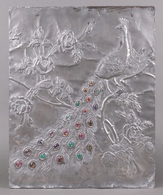 M G Brow, an embossed pewter plaque decorated a peacock, inlaid cabochon hardstones 52cm h x 42cm w, (the reverse labelled "This original and unique pewter fire screen won a competition when it was worked by my mother in the 1950's")