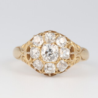 A 18ct gold diamond cluster ring, set 8 old cut diamonds approx. 0.6ct, size R 1/2, 6.4 grams 