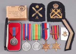 A group of 5 medals to Royston Lionel Swain Royal Navy, Air Fitter Fourth Class Royal Navy, comprising 1939/45 Star with MID, Burma Star with Pacific clasp, Defence and War medal with 2 MID, Elizabeth II issue Imperial Long Service medal boxed, together with a warrant for MID dated 14th June 1945, Warrant for Imperial Service medal, Crossing The Line certificate, Certificate of Merit, dated 1972, various photographs of HMS Illustrious, correspondence from HM Illustrious, Certificate of Service etc 