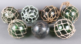 Seven 19th Century green glass fishing floats/buoys 