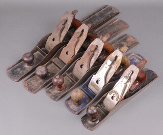 A Stanley no.7 metal Jack plane, a no.8 ditto, a Bailey Sargent no.6, a Record no.50 1/2 smoothing plane and a Millers Falls  plane