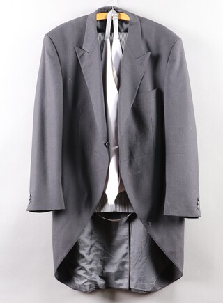 A black tail coat size 44 together with a dark grey waistcoat size 42 and a pair of striped trousers marked 42, 30 inside leg 