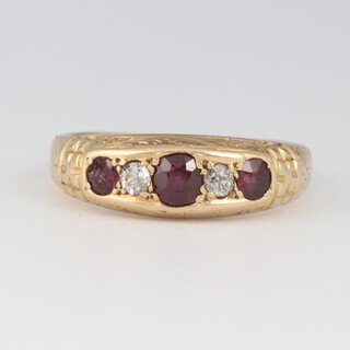 An 18ct gold diamond and ruby set ring, size Q, 3.9 grams