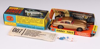 Corgi Toys, a James Bond Aston Martin DB5 no.261 Gold Finger edition model car, boxed, with original insert and complete with secret instructions (opened) and stickers, also with spare driver and passenger 