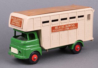Tri-Ang Toys, a Heath & Downs Newmarket & Epsom stables horse box with green cab, red hubs and cream body with maroon roof 