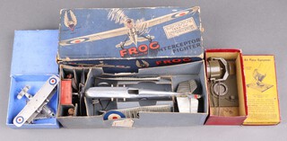 A collection of vintage early toys to include a Frog Mark IV Interceptor fighter (boxed), a Britains RAF search light (boxed), a Dinky Singapore Flying Boat no.60H and a smaller Dinky plane