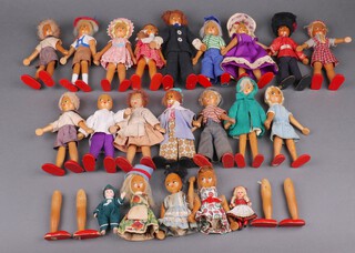 A collection of 12 mid-century Polish peg dolls in various costumes together with 5 smaller examples 