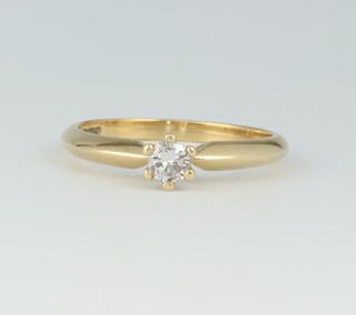 An 18ct gold solitaire diamond ring, size L, 2.7 grams