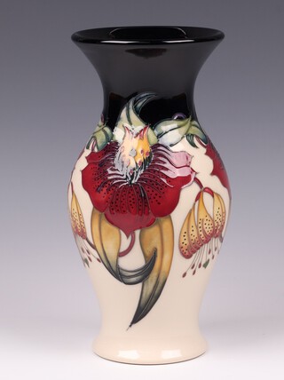 A Moorcroft Anna Lily pattern vase of waisted form, designed by Nicola Slaney the base impressed Moorcroft, 23cm 