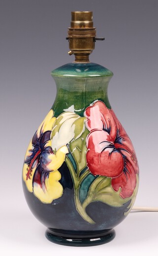 A Moorcroft Hibiscus green ground table lamp, designed by Walter Moorcroft, the base impressed Moorcroft 19cm 