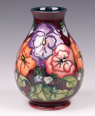 A Moorcroft Pansy pattern vase, designed by Rachel Bishop, base impressed Moorcroft '93, 19cm 