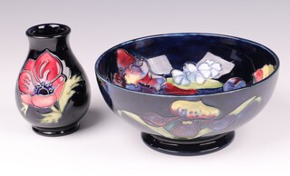 A William Moorcroft orchid pattern bowl 16cm, together with a William Moorcroft Anemone squat shaped vase, both bases impressed Moorcroft Made in England 10cm 