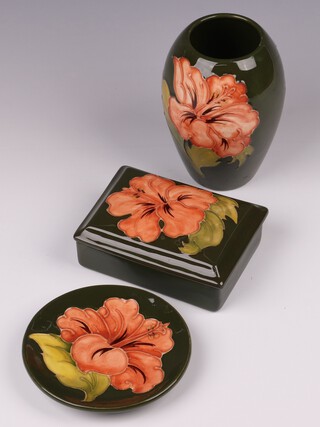 A Moorcroft green ground coral hibiscus pattern vase 12cm,  ditto dish 11cm diam. and a trinket box with cover 12cm w