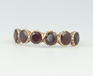 A gold testing as 9ct ring set 6 garnets, size S, 2.2 grams