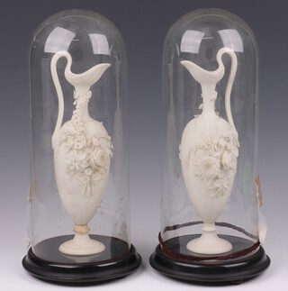 A pair of Sam Alcock and Company Victorian Parian ewers 24cm, together with 2 glazed domes on turned wooden bases 30cm h x 12 diam. 