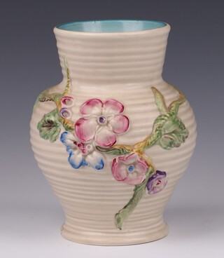 A Clarice Cliff Newport Pottery ribbed and floral patterned vase, base marked 912 17cm 