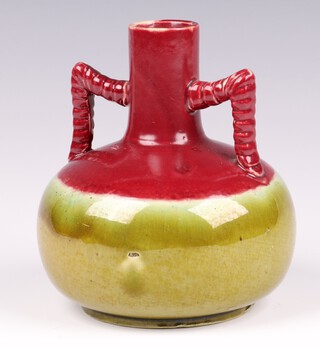 In the manner of Christopher Dresser for Ault, a red and green twin handled vase 12cm 