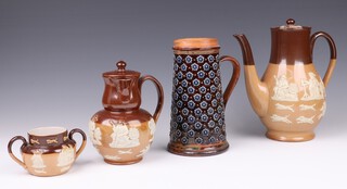 A Royal Doulton salt glazed coffee pot base marked X8866 23cm, a side handled coffee/chocolate pot 2895 17cm (chip and crack to inner lid) matching twin handled sugar bowl 7cm and a Doulton Lambeth jug 1878HW 20cm 
