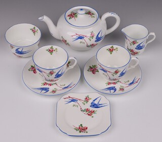 A Shelley 8 piece Bluebird pattern tea service with teapot, sugar bowl (blemish to the interior), cream jug, 2 cups (1 cracked), 2 saucers and a plate (cracked)  