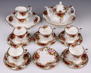 A 22 piece Royal Albert Old Country Rose pattern tea service comprising bowl (second), teapot, twin handled plate, sugar bowl, cream jug, 6 tea plates, 5 cups (1 a second) and 6 saucers