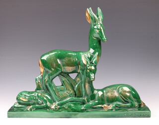 Charles Lemanceau, an Art Deco green and gilt glazed pottery figure of a Giselle and seated Giselle, the base marked Ch. Lemanceau no. 8598 France 43cm h 