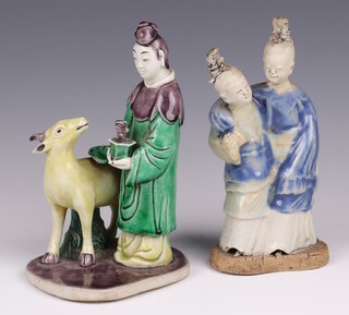 A Chinese figure of a standing man with deer 16cm together with a Chinese figure group of 2 standing ladies 16cm