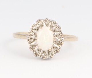 A 9ct gold "opal" and paste set ring, size N, 1.9 grams