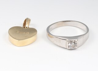 A white gold marked 375 paste set ring 2.6 grams, and a gilt metal pendant engraved "Swag" 