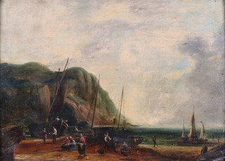 Circle of William Collins (British, 1788-1847), Fishing Boats and Figures in a Cove, 19th century oil on board, 28cm x 38cm, within a stained wood and gilt Dutch ripple frame