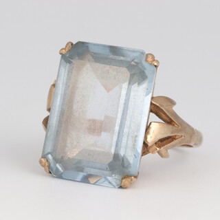 A 9ct gold and "aquamarine" set ring (slightly misshapen), size O, 9.6 grams gross