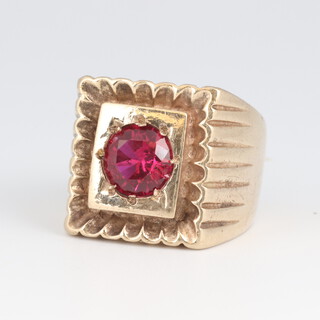 A gold marked 9ct signet ring, set a red stone, size K 1/2, 22 grams