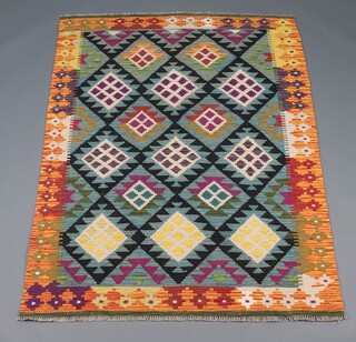 A green, black and orange ground Maimana Kilim rug with all over diamond design 185cm x 125cm 