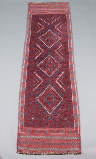 A red and blue ground Meshwani runner with 3 diamonds to the centre 233cm x 62cm 
