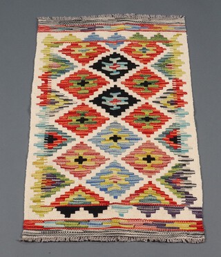 A white, green and black ground Chobi Kilim rug 99cm x 57cm 