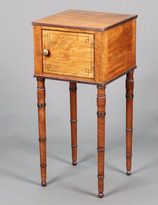 A Georgian mahogany pot cupboard enclosed by a panelled door, raised on turned supports 80cm h x 37cm w x 37cm d