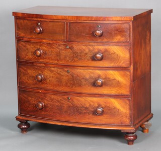A Victorian mahogany bow front chest of 2 short and 3 long graduated drawers, raised on turned feet 104cm h x 106cm w x 56cm d 